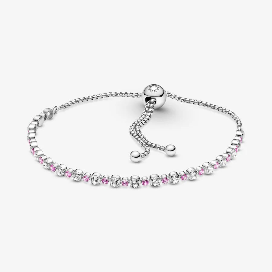 Rhodium plated sterling silver slider bracelet with clear cubic zirconia and synthetic pink sapphire